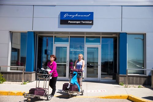 MIKAELA MACKENZIE / WINNIPEG FREE PRESS
Barbara Pawluck (left) and Wynter Payjack (12), who came from Prince George by air and are headed for Neepawa later today take a turn around the parking lot for a Global news camera at the Greyhound bus terminal in Winnipeg on Monday, July 9, 2018. Greyhound is cutting all of their prairie services this October.
Mikaela MacKenzie / Winnipeg Free Press 2018.