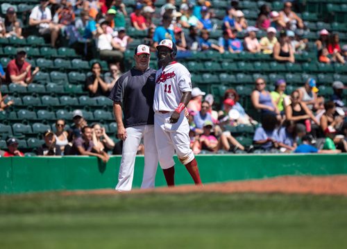 ANDREW RYAN / WINNIPEG FREE PRESS Reggie Abercrombie embraces third base coach Tom Vaeth after stealing his 500th base in Goldeyes game action against the Sioux Lookout Canaries on July 10, 2018.
