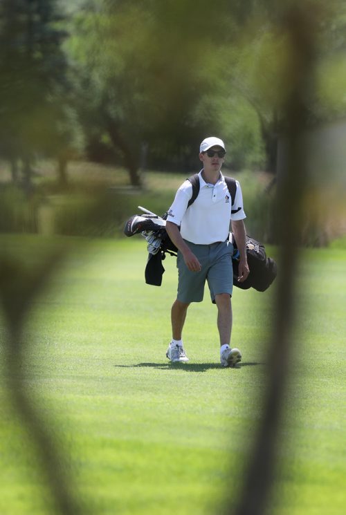 RUTH BONNEVILLE / WINNIPEG FREE PRESS


Sports, 
Ryan McMillan makes his way to the green on the 18th hole at the Mens Junior Championships at Breezy Bend Golf Course Tuesday.  


July 10, 2018 
