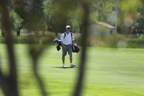 RUTH BONNEVILLE / WINNIPEG FREE PRESS


Sports, 
Ryan McMillan makes his way to the green on the 18th hole at the Mens Junior Championships at Breezy Bend Golf Course Tuesday.  


July 10, 2018 
