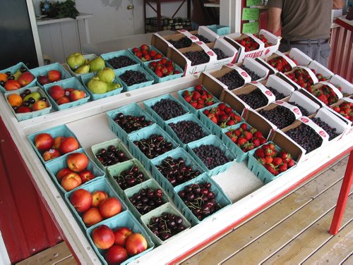 Canstar Community News July 3, 2018 - Fresh strawberries and Saskatoon berries are offered for sale at The Little Red Barn. (ANDREA GEARY/CANSTAR COMMUNITY NEWS)