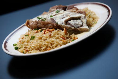 JOHN WOODS / WINNIPEG FREE PRESS
Mansaf - in sour yogurt, bone in lamb on basmati rice garnished with pine nuts and parsley at Ali Baba restaurant photographed in Winnipeg Tuesday, July 10, 2018.

