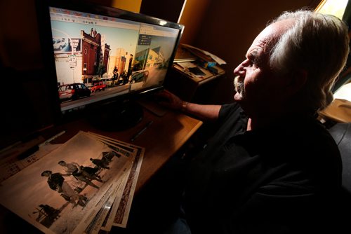 JOHN WOODS / WINNIPEG FREE PRESS
Robert Callaghan, who runs a website about Winnipeg theatres of yesteryear,  looks through old theatre photos and movie photos in his home in Winnipeg Tuesday, July 10, 2018. The computer images are of the Logan and Main intersection which had 5 theatres at one time.

