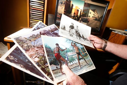 JOHN WOODS / WINNIPEG FREE PRESS
Robert Callaghan, who runs a website about Winnipeg theatres of yesteryear,  looks through old theatre photos and movie photos in his home in Winnipeg Tuesday, July 10, 2018. The computer images are of the Logan and Main intersection which had 5 theatres at one time.



