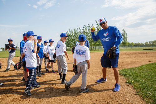 MIKE DEAL / WINNIPEG FREE PRESS
The Blue Jays Baseball Academy set up in Île-des-Chênes, MB, Tuesday making it one of the fourteen Super Camps that are taking place in various towns and cities across the country. The super camps give kids aged 9-16 skills and techniques from former Major Leaguer players.
Former Blue Jays second baseman, Roberto Alomar, gives kids pointers on catching and throwing the ball.
180711 - Wednesday, July 11, 2018.