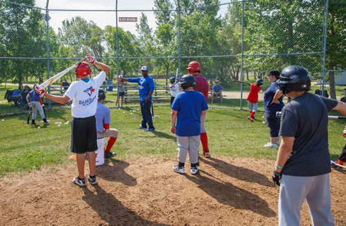 MIKE DEAL / WINNIPEG FREE PRESS
The Blue Jays Baseball Academy set up in Île-des-Chênes, MB, Tuesday making it one of the fourteen Super Camps that are taking place in various towns and cities across the country. The super camps give kids aged 9-16 skills and techniques from former Major Leaguer players.
Former Blue Jays second baseman, Homer Bush, gives kids pointers on batting.
180711 - Wednesday, July 11, 2018.