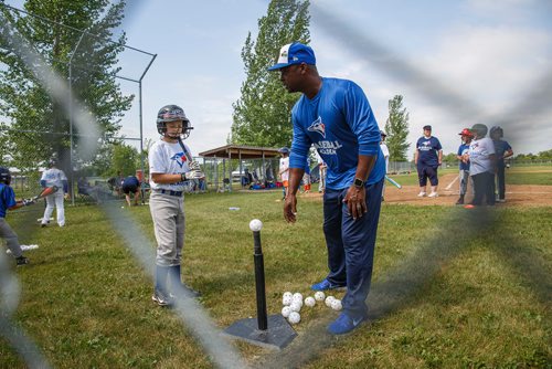 MIKE DEAL / WINNIPEG FREE PRESS
The Blue Jays Baseball Academy set up in Île-des-Chênes, MB, Tuesday making it one of the fourteen Super Camps that are taking place in various towns and cities across the country. The super camps give kids aged 9-16 skills and techniques from former Major Leaguer players.
Former Blue Jays second baseman, Homer Bush, gives Marcus Burak, 9, pointers on batting.
180711 - Wednesday, July 11, 2018.