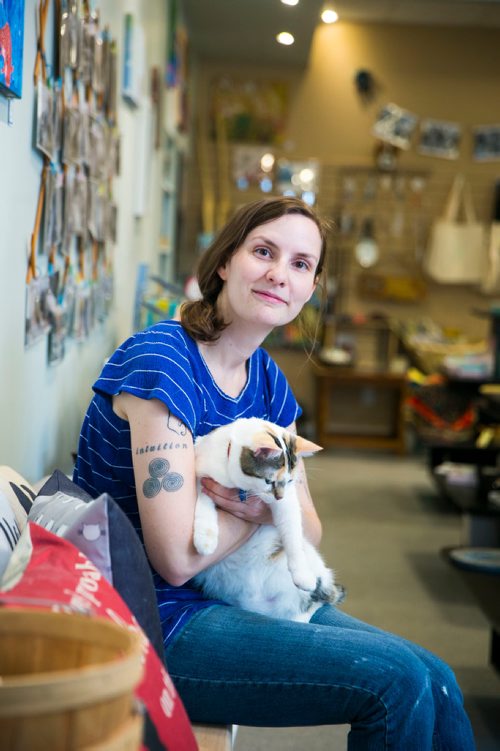 MIKAELA MACKENZIE / WINNIPEG FREE PRESS
Jessica Thompson, CARE Cat Community Outreach Liaison (aka professional cat lady) , poses with a few furry friends at the CARE store in Winnipeg on Wednesday, July 11, 2018. 
Mikaela MacKenzie / Winnipeg Free Press 2018.