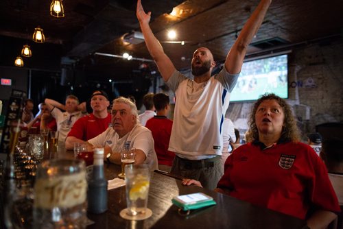 ANDREW RYAN / WINNIPEG FREE PRESS Andrew Walker raises his hand in protest after a bad call against England in extra time against Croatia at the Kings Head bar on July 11, 2018.