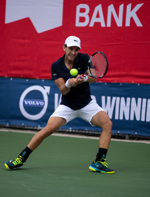 ANDREW RYAN / WINNIPEG FREE PRESS Filip Peliwo returns a hit from Benjamin Sogouin during the National Bank Challenger at the Winnipeg Lawn Tennis Club on July 11, 2018.