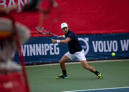 ANDREW RYAN / WINNIPEG FREE PRESS Filip Peliwo returns a hit from Benjamin Sogouin during the National Bank Challenger at the Winnipeg Lawn Tennis Club on July 11, 2018.