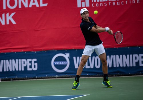 ANDREW RYAN / WINNIPEG FREE PRESS Filip Peliwo returns a hit from Benjamin Sogouin during the National Bank Challenger at the Winnipeg Lawn Tennis Club on July 11, 2018.