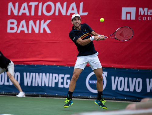 ANDREW RYAN / WINNIPEG FREE PRESS Filip Peliwo returns a hit from Benjamin Sogouin during the National Bank Challenger at the Winnipeg Lawn Tennis Club on July 11, 2018.