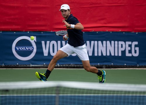 ANDREW RYAN / WINNIPEG FREE PRESS Filip Peliwo returns a hit from Benjamin Sogouin during the National Bank Challenger at the Winnipeg Lawn Tennis Club on July 11, 2018.