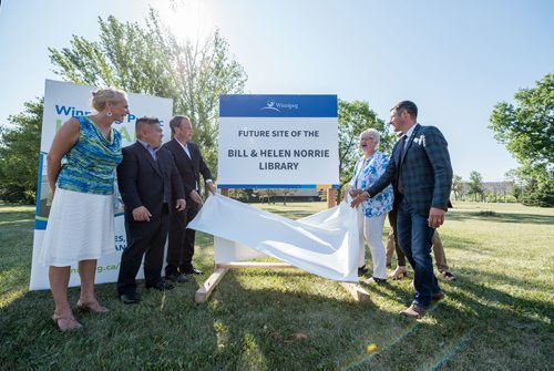 DAVID LIPNOWSKI / WINNIPEG FREE PRESS

A sign is unveiled during the official unveiling of the location of the future River Heights Library, renamed the Bill & Helen Norrie Library Friday July 13, 2018.
(l-r) Director of Community Services Cindy Fernandes, Councillor Mike Pagtakhan, Councillor John Orlikow, Helen Norrie, Mayor Brian Bowman.
