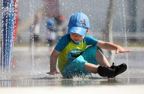RUTH BONNEVILLE / WINNIPEG FREE PRESS

RJ Mader (3yrs) cools himself  at The Gateway Recreation Centre spray pad in the scorching heat Friday.  
Standup photo 


July 13, 2018 

