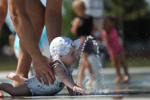 RUTH BONNEVILLE / WINNIPEG FREE PRESS

Hailey Sharman (8 months) reaches for the cool water coming from the spray pad as she sees her older brother, Jacob (2yrs, not in picture) and other kids  play at the Gateway Recreation Centre spray pad in the scorching heat Friday.  Her dad, Allan Sharman, watches her  closely as her mom attends to her  brother Jacob.  

Standup photo 


July 13, 2018 

