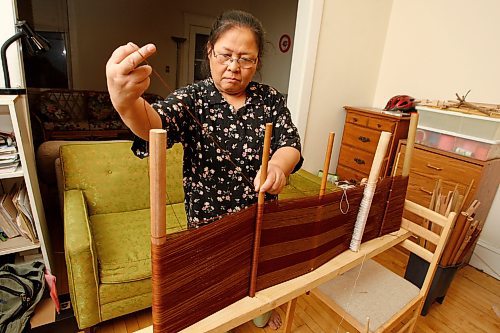 BORIS MINKEVICH / WINNIPEG FREE PRESS 090126 Kay Seng is a Karen Refugee from Burma that makes traditional clothing in her Winnipeg apartment.