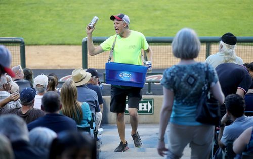 TREVOR HAGAN / WINNIPEG FREE PRESS
Jakob Sanderson, 21, selling beer during the Winnipeg Goldeyes game, Friday, July 13, 2018. 24hourproject