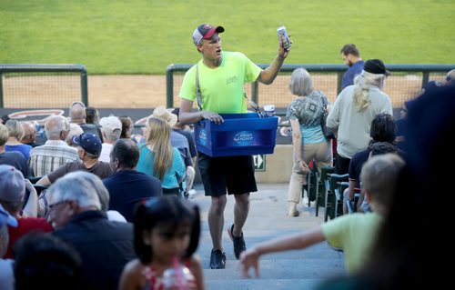 TREVOR HAGAN / WINNIPEG FREE PRESS
Jakob Sanderson, 21, selling beer during the Winnipeg Goldeyes game, Friday, July 13, 2018. 24hourproject