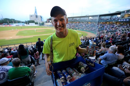 TREVOR HAGAN / WINNIPEG FREE PRESS
Jakob Sanderson, 21, selling beer during the Winnipeg Goldeyes game, Friday, July 13, 2018. 24hourproject