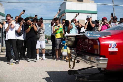 ANDREW RYAN / WINNIPEG FREE PRESS  A crowd winces at the sheer volume of Eric Bone's dragster during an exhaust competition, where competitors compete for the loudest car at the Driven car festival on July 14, 2018.