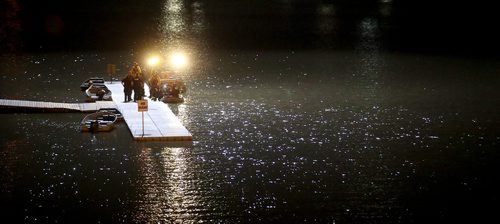 TREVOR HAGAN / WINNIPEG FREE PRESS
The spotlight from AIR 1, the police helicopter lights up a water rescue, around 2:20am seen from the Norwood Bridge, Sunday, July 15, 2018.