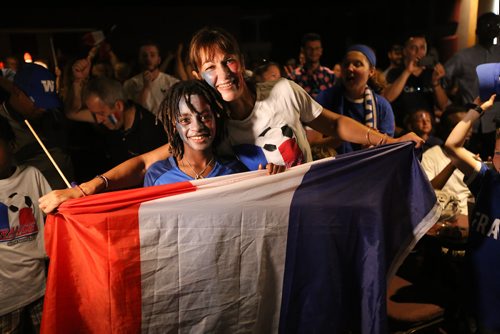 TREVOR HAGAN / WINNIPEG FREE PRESS
Naeem, 11, and Nathalie Piquemal, celebrating at the Franco Manitoban Cultural Centre as their team wins the World Cup Final, Sunday, July 15, 2018. Nathalie is originally from France.