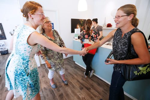 JOHN WOODS / WINNIPEG FREE PRESS
Green party leader Elizabeth May (C) meets local residents with St Boniface by-election candidate Françoise Therrien Vrignon (L) in Winnipeg Sunday, July 15, 2018.


