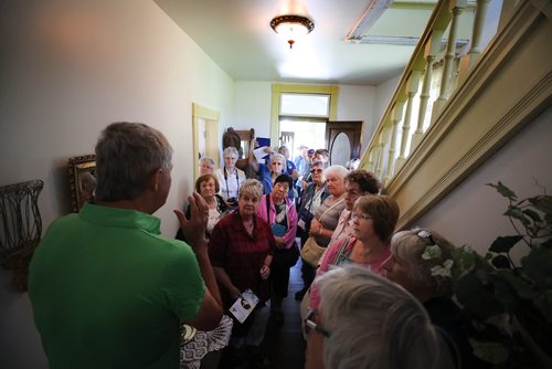 RUTH BONNEVILLE / WINNIPEG FREE PRESS

Nellie McClung Heritage site tour.  

Photo of site's tour guide Al Thorleifson (green shirt, centre) standing in the foyer of the McClung home describing details of the home to the group while on tour. 

Photos of members of the Federated Women's Institutes of Canada (FWIC) touring Nellie McClungs Heritage Site in Manitou, Manitoba Monday.  For story by Bill Redekop.
 

 The site includes two homes that she lived in, The Hazel cottage that she boarded in with the Hasselfield family when she  began her career as a teacher in Manitou at the age of16 years old and McClung House where she penned two of her 16 books and gave birth to four of their five children in Manitou and raised them in McClung House.  The 3rd home on the site is a typical log home from her era with artifacts and gift store. 

See story Redekop story.  


July 16, 2018 

