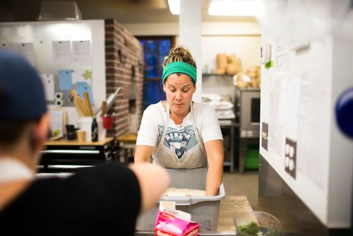 MIKAELA MACKENZIE / WINNIPEG FREE PRESS
Owner Suzanne Gessler turns the bread dough at Pennyloaf bakery in Winnipeg on Friday, July 13, 2018. 24hourproject
Mikaela MacKenzie / Winnipeg Free Press 2018.