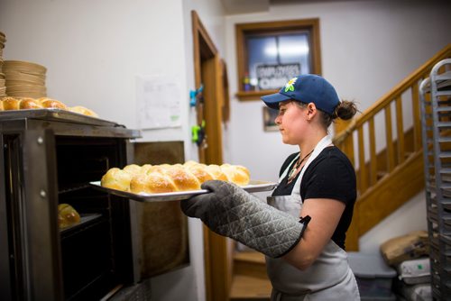 MIKAELA MACKENZIE / WINNIPEG FREE PRESS
Brittney Albanese, assistant manager, turns the challah at Pennyloaf bakery in Winnipeg on Friday, July 13, 2018. 24hourproject
Mikaela MacKenzie / Winnipeg Free Press 2018.