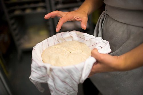 MIKAELA MACKENZIE / WINNIPEG FREE PRESS
Owner Suzanne Gessler demonstrated the resiliency of a properly proofed loaf in Winnipeg on Friday, July 13, 2018. 24hourproject
Mikaela MacKenzie / Winnipeg Free Press 2018.