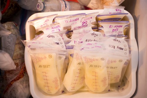 MIKAELA MACKENZIE / WINNIPEG FREE PRESS
Jenn Kiziak stores milk in the freezer in her home in Winnipeg on Friday, July 13, 2018. Baby Aurora still won't take a bottle, so Skiziak has a surplus of breast milk. 24hourproject
Mikaela MacKenzie / Winnipeg Free Press 2018.