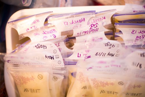 MIKAELA MACKENZIE / WINNIPEG FREE PRESS
Jenn Kiziak stores milk in the freezer in her home in Winnipeg on Friday, July 13, 2018. Baby Aurora still won't take a bottle, so Skiziak has a surplus of breast milk. 24hourproject
Mikaela MacKenzie / Winnipeg Free Press 2018.