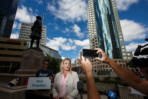 MIKE DEAL / WINNIPEG FREE PRESS
Jenny Motkaluk holds a press conference in front of the Bank of Montreal building at Portage and Main as part of her campaign against re-opening the intersection.
180717 - Tuesday, July 17, 2018.