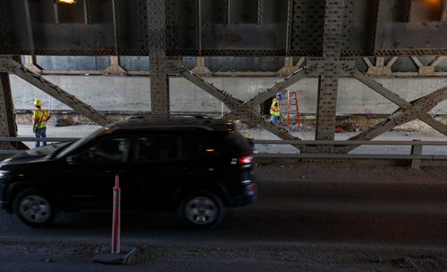 MIKE DEAL / WINNIPEG FREE PRESS
The Mcphillips underpass is being dug deeper so trucks no longer slam into the rail bridge above.
180717 - Tuesday, July 17, 2018.