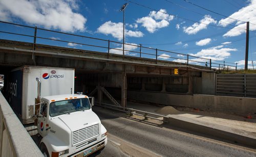 MIKE DEAL / WINNIPEG FREE PRESS
The Mcphillips underpass is being dug deeper so trucks no longer slam into the rail bridge above.
180717 - Tuesday, July 17, 2018.