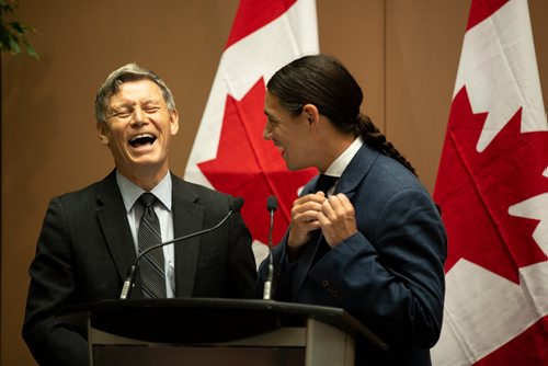 ANDREW RYAN / WINNIPEG FREE PRESS  MP Robert-Falcon Ouelette makes a joke, chiding Terry Duguid, Parlimentary Secretary for status of Women, on stage for not having a moose skin patch. The two were there to help announce the new federal funding allotment to help improve women's presence in information and communication technologies on July 17, 2018.