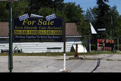 PHIL HOSSACK / WINNIPEG FREE PRESS - 49.8 POWERVIEW/PINE FALLS - For sale signs front homes and businesses all through the former milltown. See Ryan's story.  - July 17, 2018