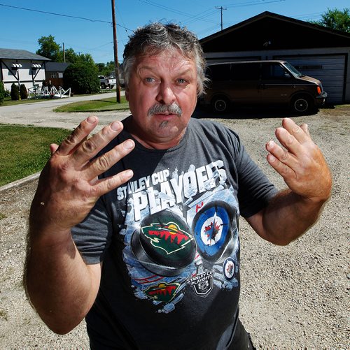 PHIL HOSSACK / WINNIPEG FREE PRESS - 49.8 POWERVIEW/PINE FALLS - "Worked my fingers to the bone", not so jokingly says Gary Berthelette brandishing his hands. He lost three finger to a mitre saw renovating his apartment building in the community where he provides low cost housing.   See Ryan's story.  - July 17, 2018