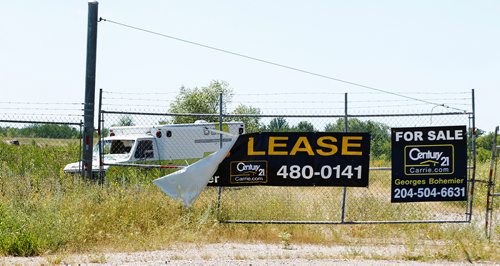 PHIL HOSSACK / WINNIPEG FREE PRESS - 49.8 POWERVIEW/PINE FALLS - For sale signs front homes and businesses all through the former milltown. Here at the site of the former Paper mill where an attampt is being made to establish a business park.  See Ryan's story.  - July 17, 2018
