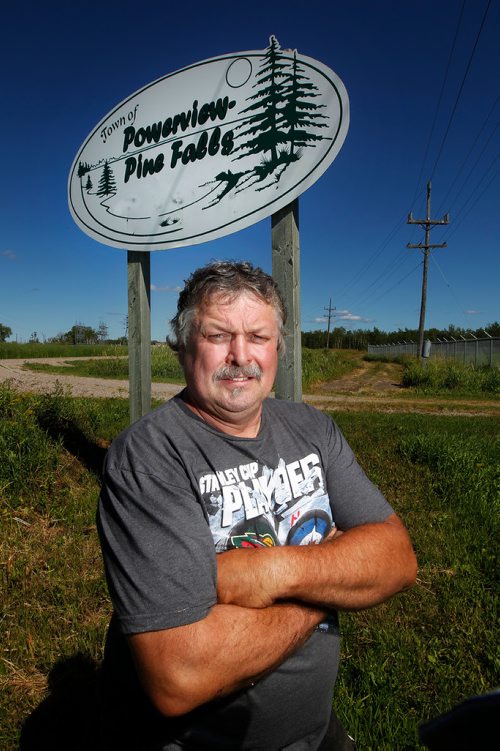 PHIL HOSSACK / WINNIPEG FREE PRESS - 49.8 POWERVIEW/PINE FALLS - Pine Falls proud, Gary Berthelette poses in front of the sign leading into the former mill town.  See Ryan's story.  - July 17, 2018