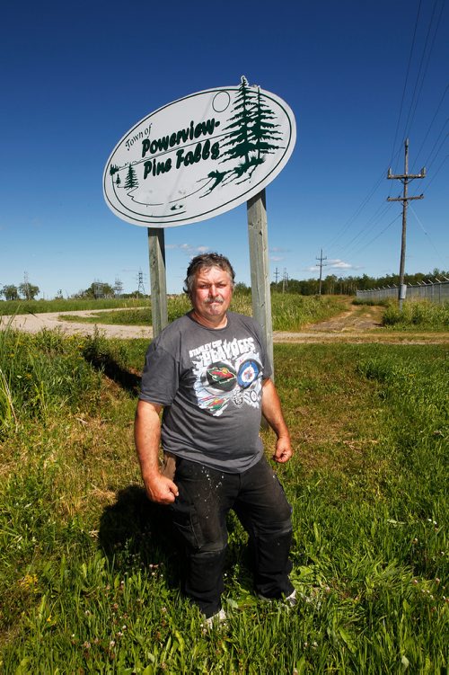 PHIL HOSSACK / WINNIPEG FREE PRESS - 49.8 POWERVIEW/PINE FALLS -Pine Falls Proud Gary Berthelette poses in front of the sign leading into the former Milltown.  See Ryan's story.  - July 17, 2018