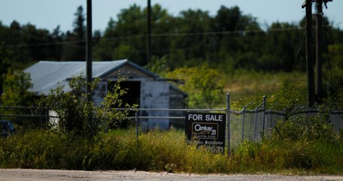 PHIL HOSSACK / WINNIPEG FREE PRESS - 49.8 POWERVIEW/PINE FALLS - For sale signs front homes and businesses all through the former milltown. Here at the site of the former Paper mill where an attampt is being made to establish a business park.  See Ryan's story.  - July 17, 2018