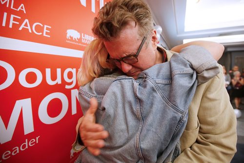 JOHN WOODS / WINNIPEG FREE PRESS
Dougald Lamont, leader of the Manitoba Liberal Party, hugs his daughter Frances as they celebrate a win in the St. Boniface by-election in Winnipeg Tuesday, July 17, 2018.