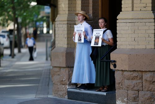 JOHN WOODS / WINNIPEG FREE PRESS
Alexandra Chase, left, and Hannah McKenna, performing tour guides, lead tours through The Exchange in Winnipeg Tuesday, July 17, 2018.