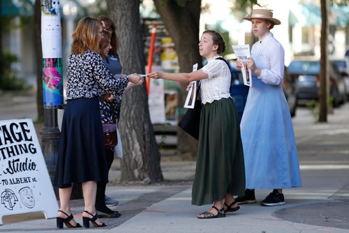 JOHN WOODS / WINNIPEG FREE PRESS
Alexandra Chase, right, and Hannah McKenna, performing tour guides, lead tours through The Exchange in Winnipeg Tuesday, July 17, 2018.