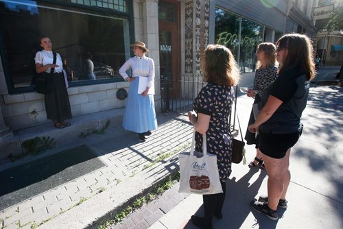 JOHN WOODS / WINNIPEG FREE PRESS
Alexandra Chase, right, and Hannah McKenna, performing tour guides, lead tours through The Exchange in Winnipeg Tuesday, July 17, 2018.