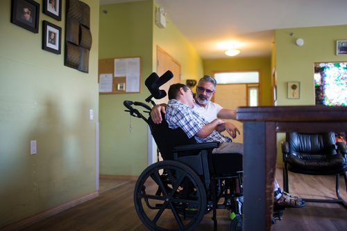 MIKAELA MACKENZIE / WINNIPEG FREE PRESS
Benjamin Brubacher, 31, and his dad, Mark, spend time together before Benjamin gets tube fed in his group home in Winnipeg on Friday, July 13, 2018. 24hourproject
Mikaela MacKenzie / Winnipeg Free Press 2018.